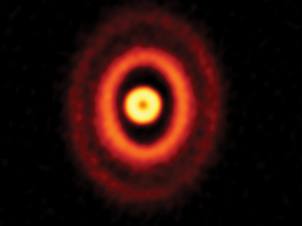 Un pianeta gassoso in formazione orbiterebbe attorno a tre stelle contemporaneamente, in un giovanissimo sistema stellare triplo chiamato GW Ori